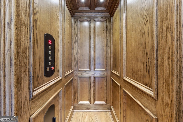 interior details with elevator and wooden walls