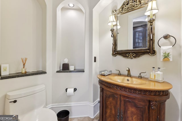 bathroom with vanity and toilet