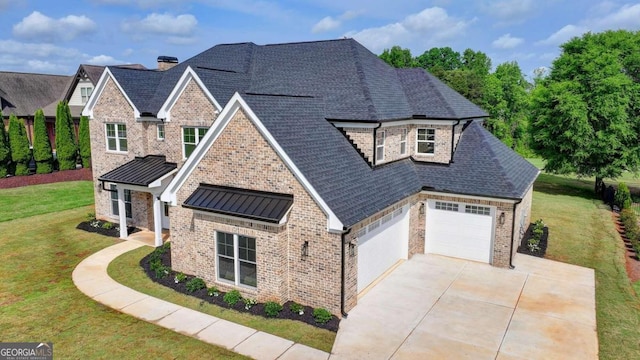 view of front facade with a garage and a front yard