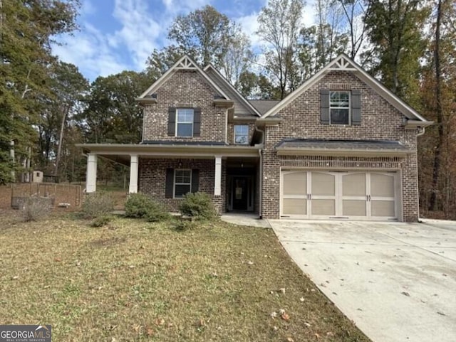 craftsman-style home with a front yard and a garage