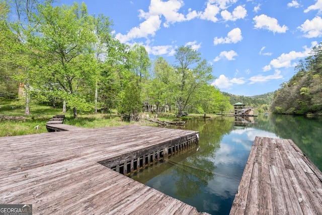 view of dock with a water view