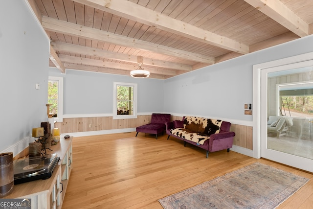 living room with wooden ceiling, beam ceiling, and light hardwood / wood-style flooring