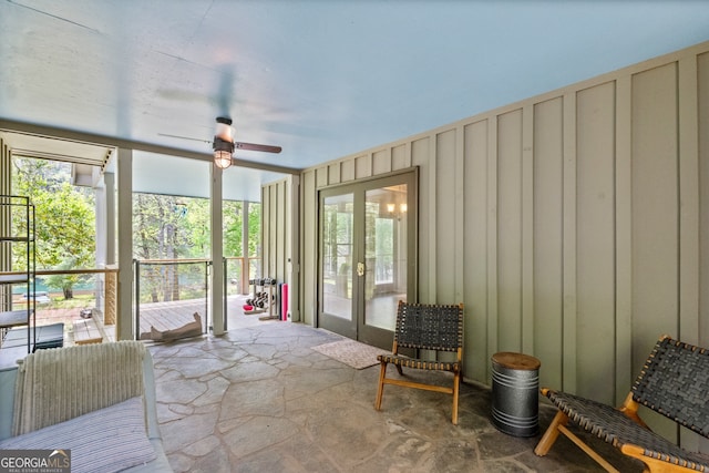 sunroom featuring plenty of natural light, ceiling fan, and french doors