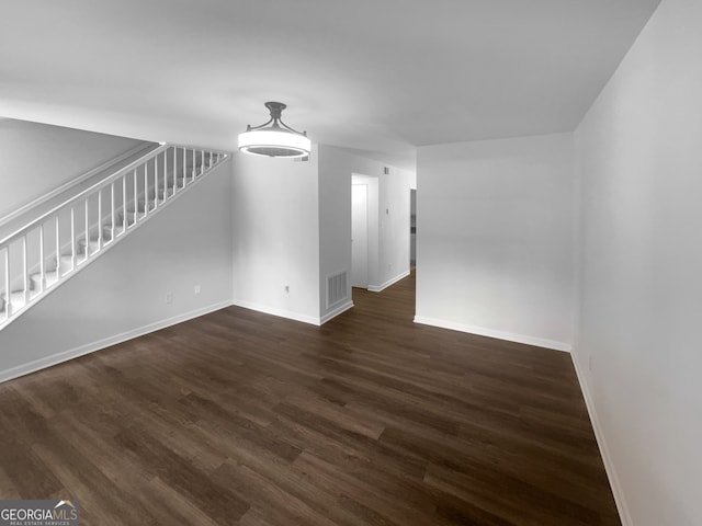 spare room featuring dark hardwood / wood-style floors