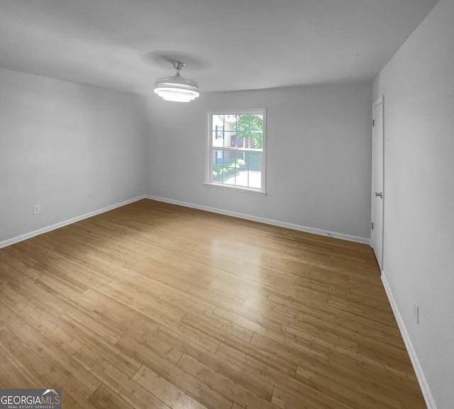 spare room with light hardwood / wood-style flooring