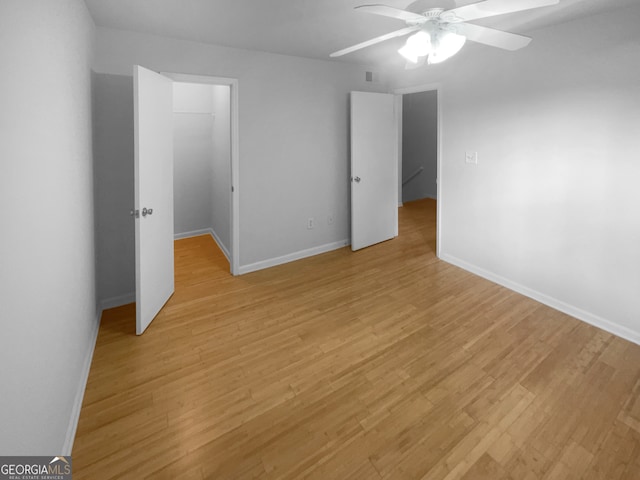 unfurnished bedroom with light hardwood / wood-style floors and ceiling fan