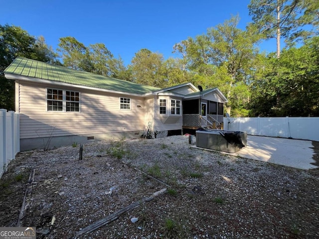 back of property with a patio