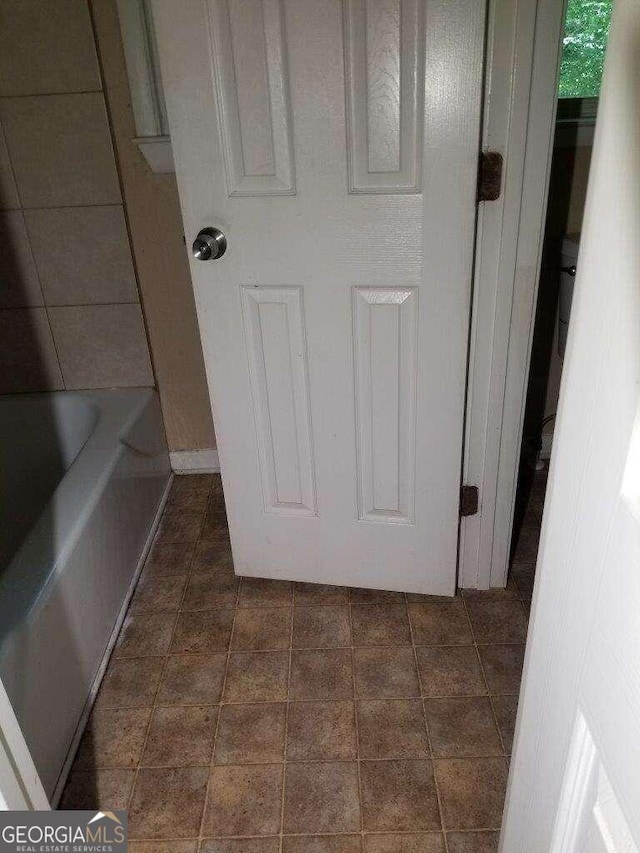 bathroom featuring tile flooring