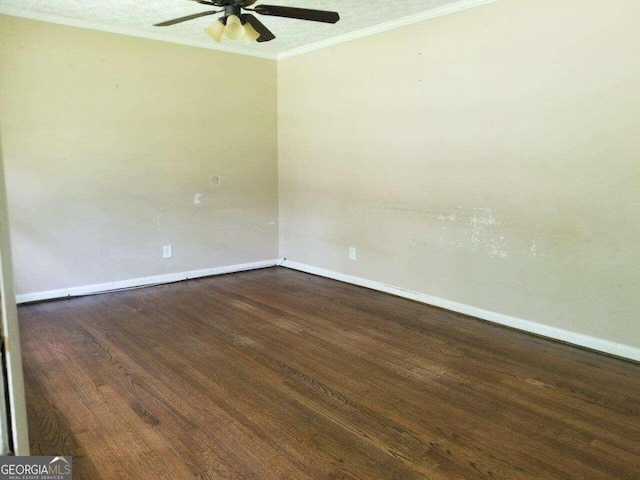 empty room featuring crown molding, ceiling fan, and dark hardwood / wood-style flooring