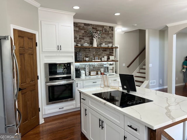 kitchen with crown molding, black appliances, light stone countertops, and dark hardwood / wood-style floors