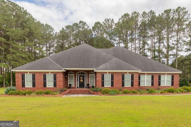 ranch-style home featuring a front yard