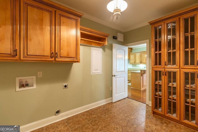 laundry room featuring tile flooring, hookup for an electric dryer, hookup for a washing machine, and ornamental molding