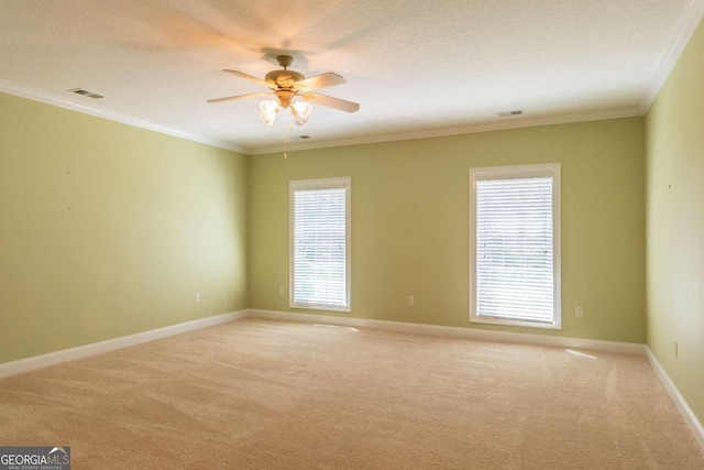 unfurnished room featuring ceiling fan, a healthy amount of sunlight, and carpet floors