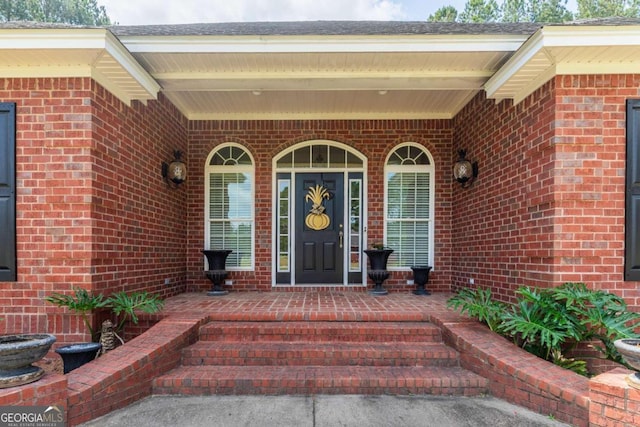 doorway to property featuring a porch