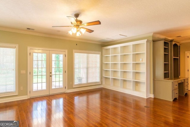 interior space featuring ceiling fan, french doors, a textured ceiling, and hardwood / wood-style flooring