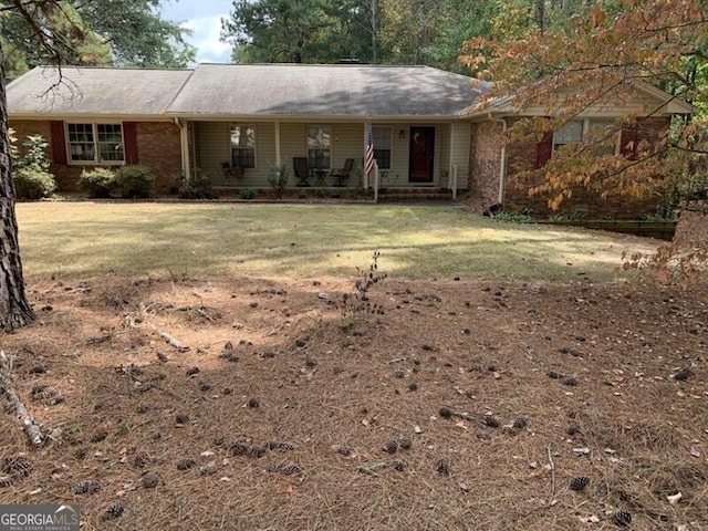 ranch-style home with a front yard