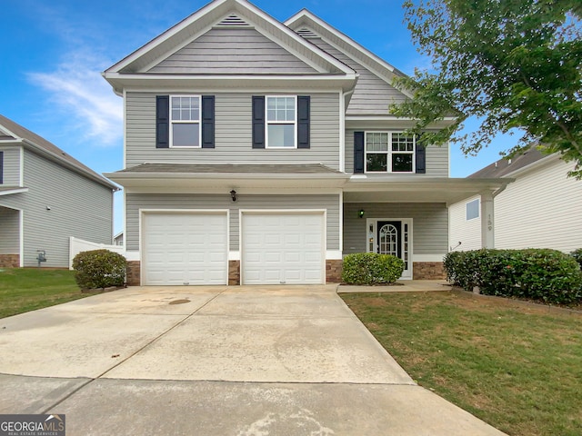 view of front of house featuring a garage and a front yard