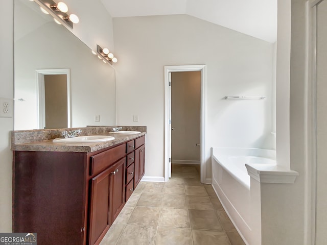 bathroom with vaulted ceiling, a washtub, double sink vanity, and tile flooring