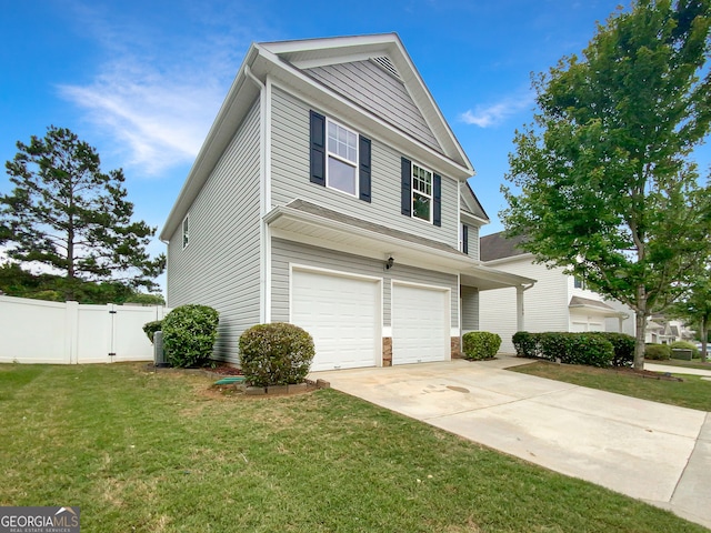 view of front of property with a front yard and a garage