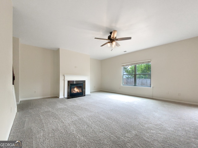 unfurnished living room with carpet floors and ceiling fan