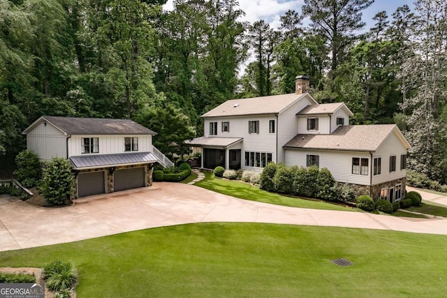 view of front facade with a garage and a front lawn