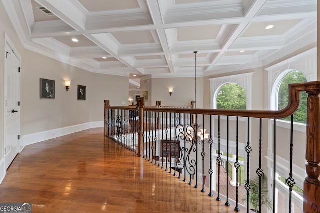 hall featuring beamed ceiling, coffered ceiling, hardwood / wood-style floors, and an inviting chandelier