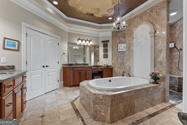 bathroom with a relaxing tiled bath, tile flooring, vanity, and a tray ceiling