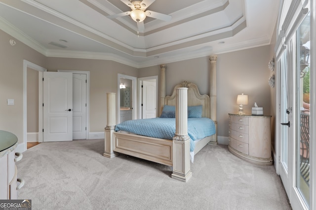 bedroom featuring crown molding, connected bathroom, ceiling fan, and a raised ceiling