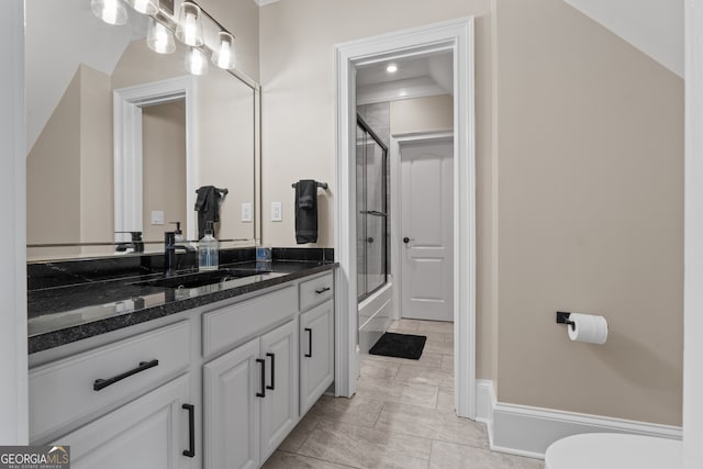 full bathroom with shower / bath combination with glass door, vanity with extensive cabinet space, toilet, tile floors, and lofted ceiling