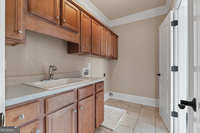 kitchen with sink, crown molding, and light tile flooring