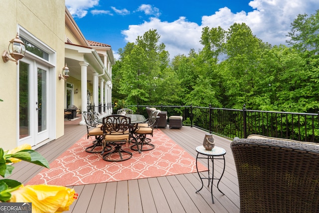 wooden deck featuring french doors