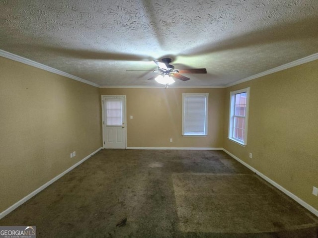 spare room with a textured ceiling, carpet floors, ornamental molding, and ceiling fan