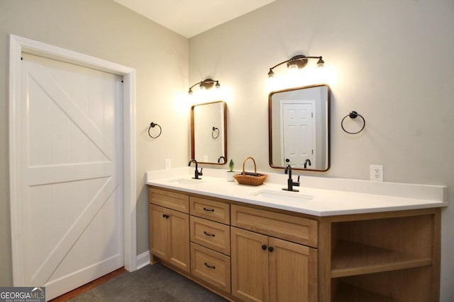 bathroom featuring large vanity and double sink