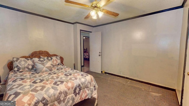 carpeted bedroom featuring ceiling fan and a textured ceiling