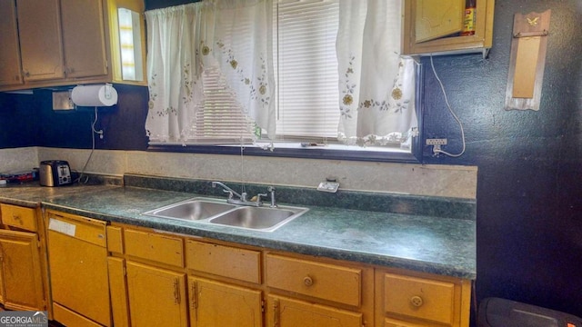 kitchen featuring a healthy amount of sunlight and sink