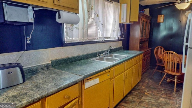 kitchen with dark tile floors, ceiling fan, white appliances, and sink