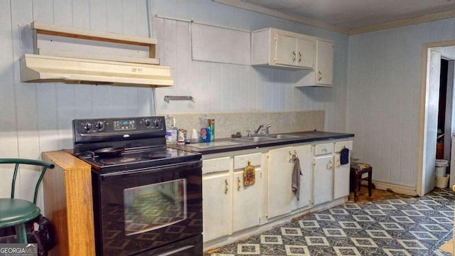 kitchen featuring black electric range, sink, white cabinetry, and custom exhaust hood