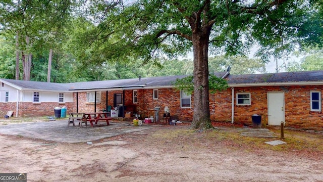 back of property featuring a patio area