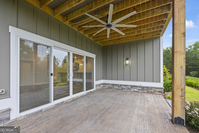 wooden terrace featuring ceiling fan