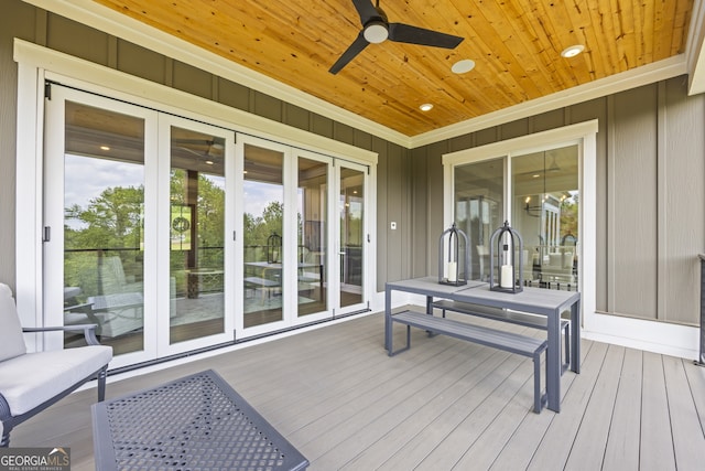 deck with ceiling fan and french doors