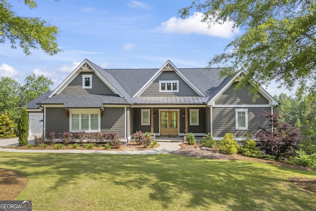 craftsman house featuring a porch and a front lawn