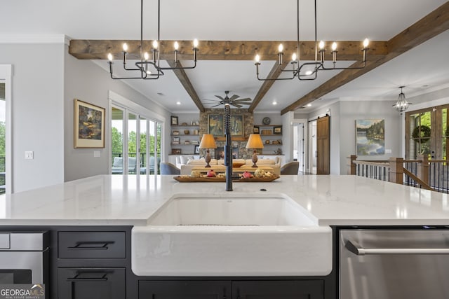 kitchen with dishwasher, beamed ceiling, a center island with sink, and a healthy amount of sunlight