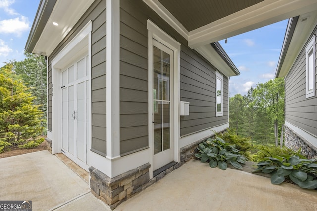 view of side of home with a patio