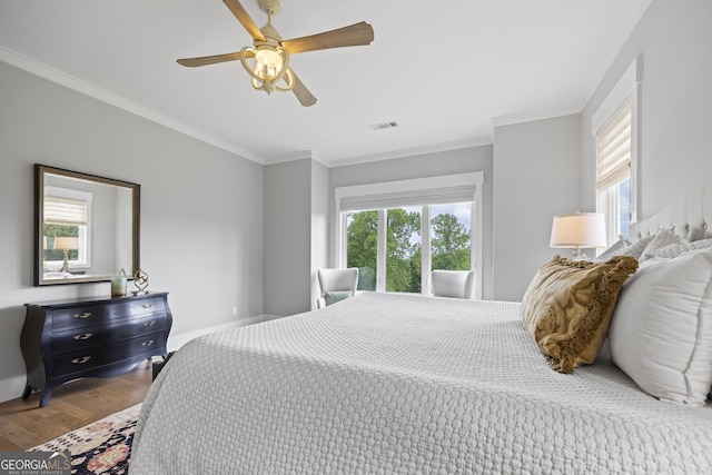 bedroom with crown molding, ceiling fan, and hardwood / wood-style flooring