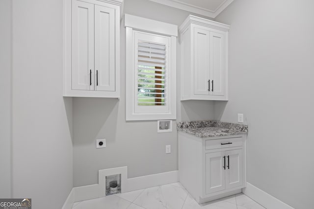 laundry area with cabinets, light tile patterned floors, hookup for an electric dryer, crown molding, and washer hookup