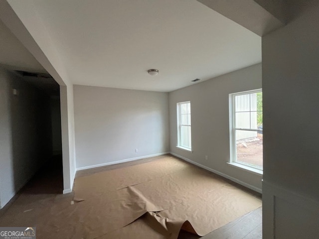 spare room with light hardwood / wood-style flooring