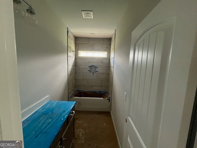 bathroom with vanity and  shower combination