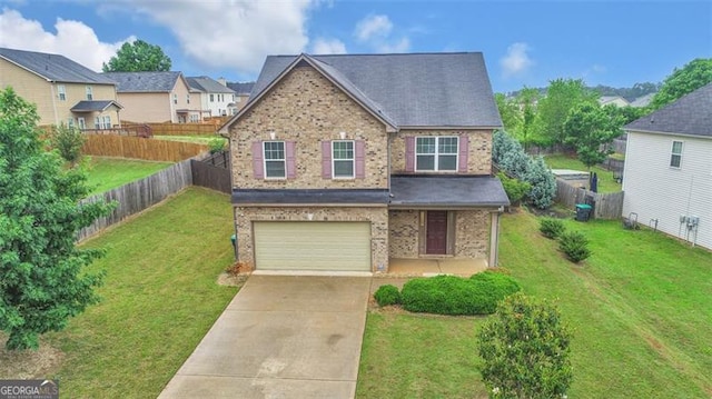 view of front of property with a front lawn and a garage