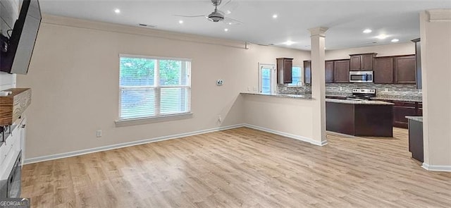 kitchen featuring light hardwood / wood-style flooring, appliances with stainless steel finishes, dark brown cabinets, backsplash, and ceiling fan