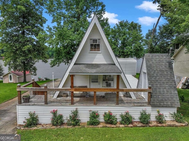 view of front of home featuring covered porch and a front yard